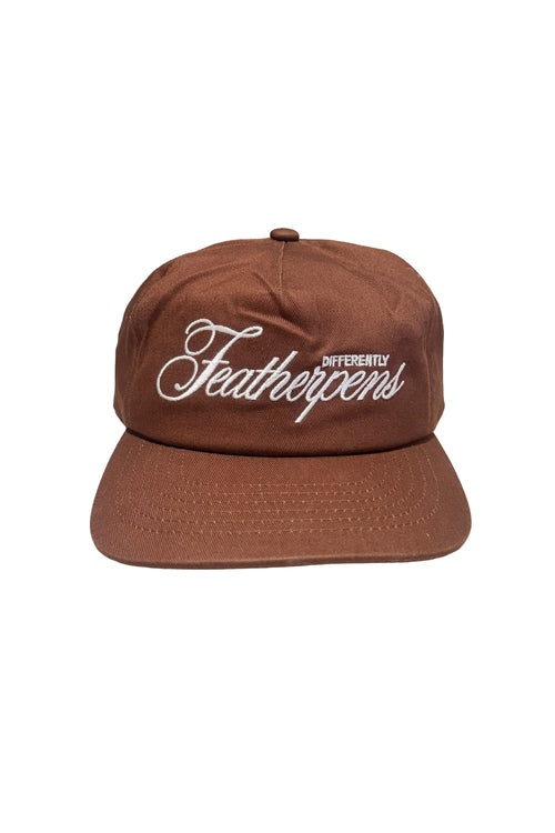 A brown flat-brim baseball cap with white embroidered text reading 'Different Feathers' on the front, shown against a plain white background.