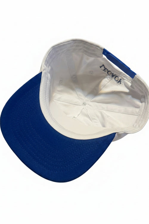 A blue and white baseball cap shown from an overhead angle, with the white interior lining and a visible embroidered 'PECHGA' logo on the inner crown.